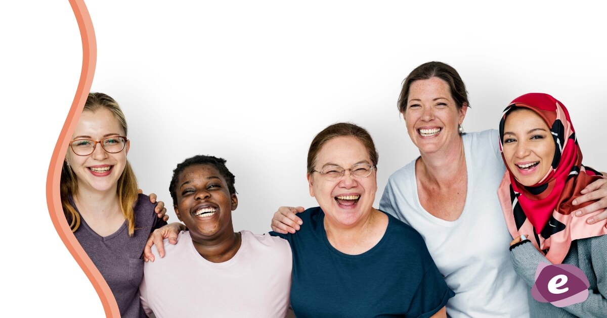 A group of women look happy and have their arms around each others shoulders